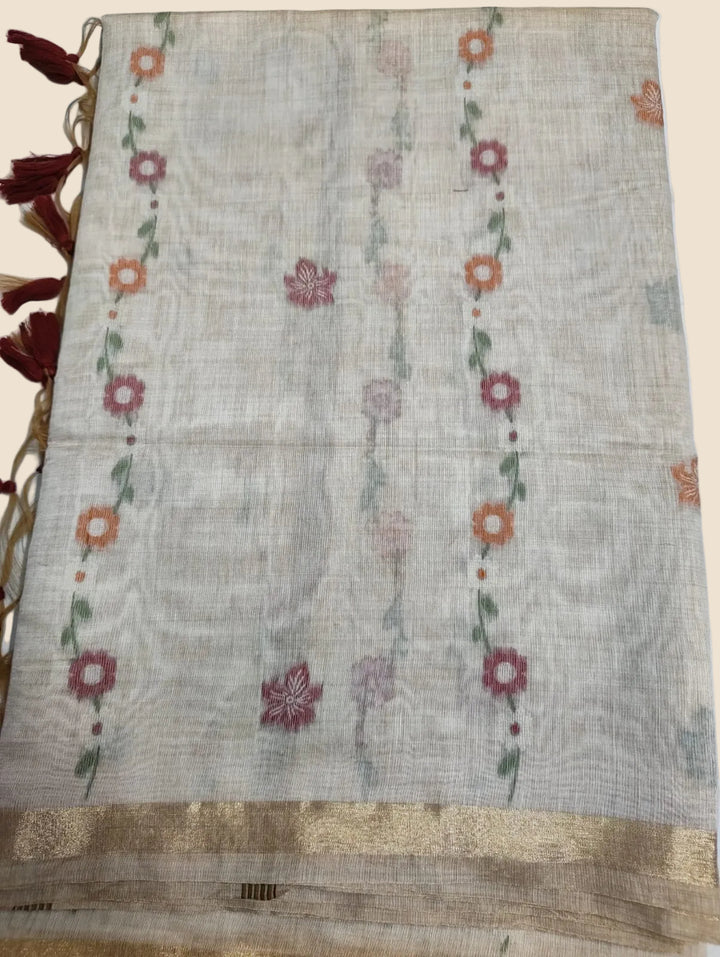 Textile with floral patterns and tassels on a white background