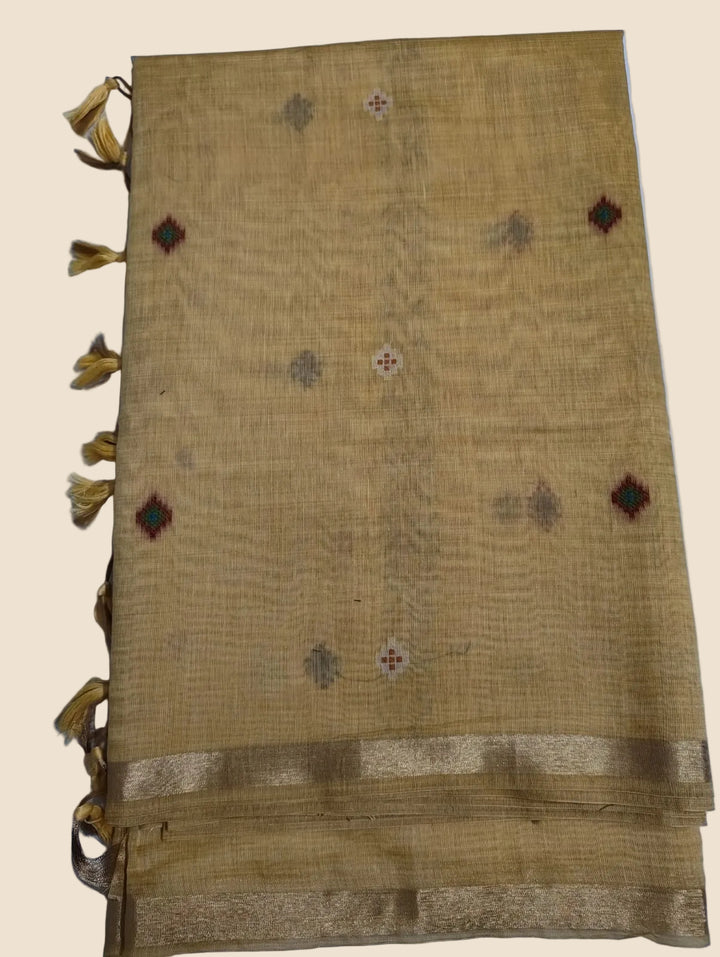 Textured fabric with decorative patterns and tassels on a light blue background