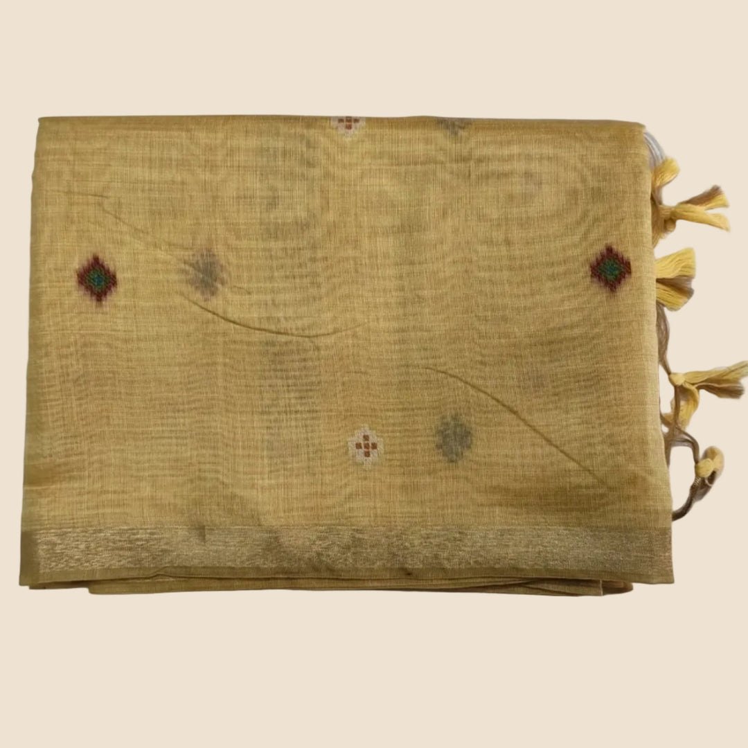 Yellow fabric with embroidered patterns on a white background