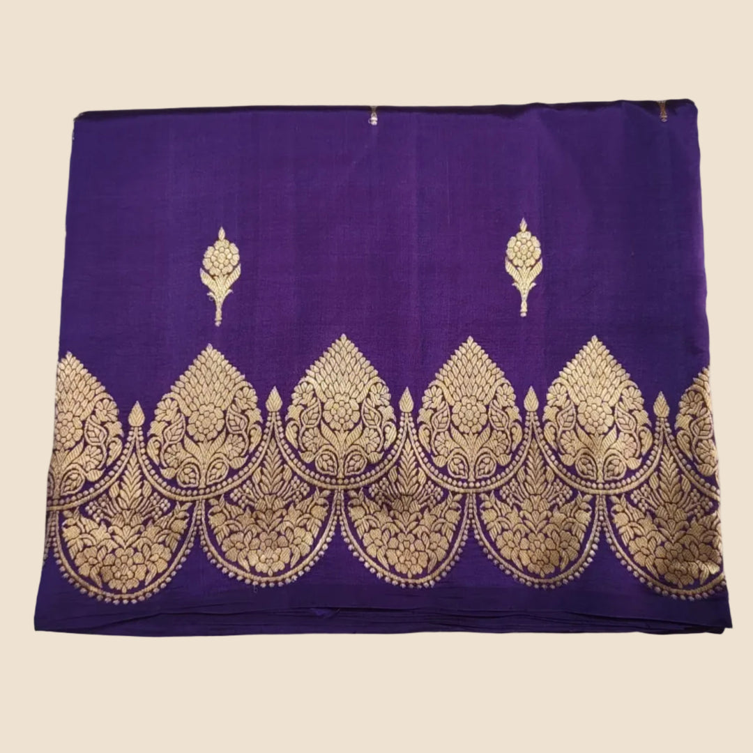 Purple fabric with gold embroidery on a white background