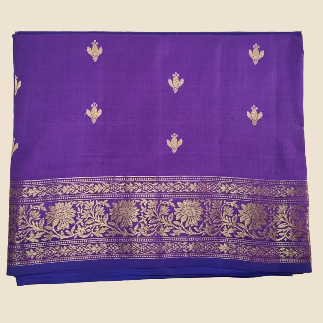 Purple fabric with gold floral patterns on a white background