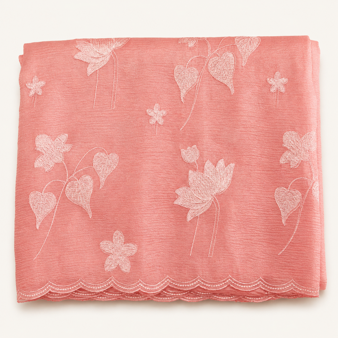 Pink fabric with floral patterns on a white background