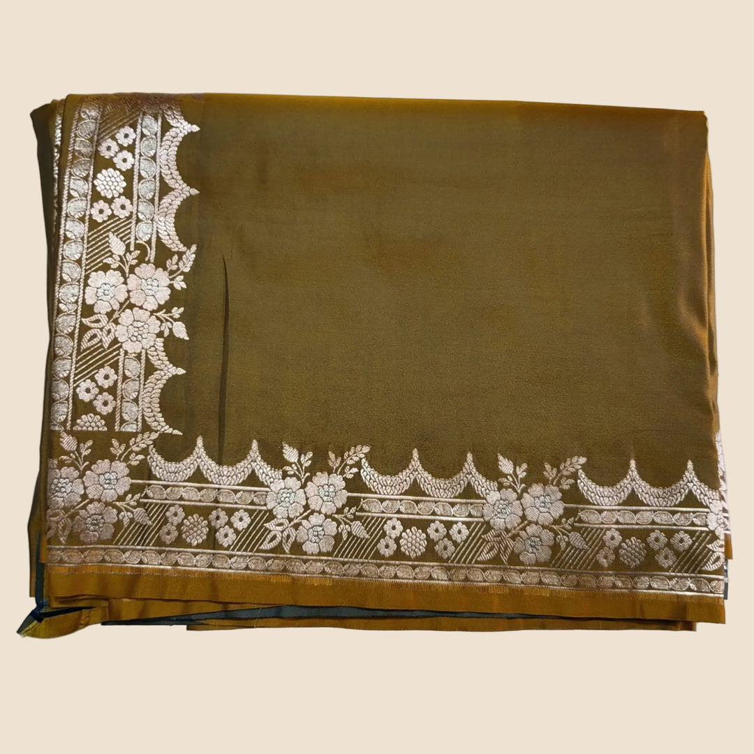 Brown fabric with white floral embroidery on a white background