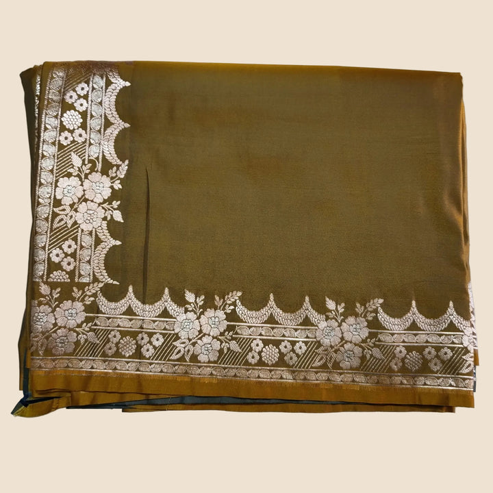 Brown fabric with white floral embroidery on a white background