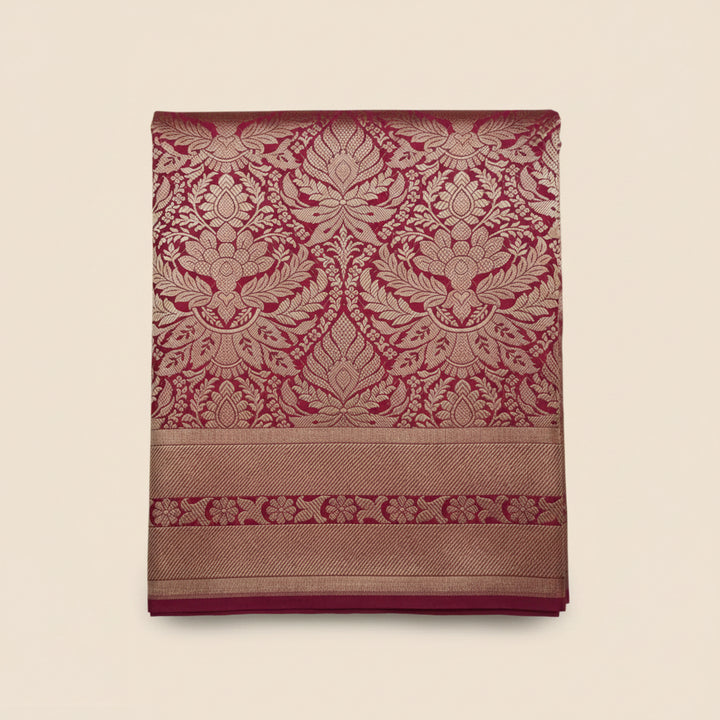 Decorative fabric with red and gold patterns on a white background