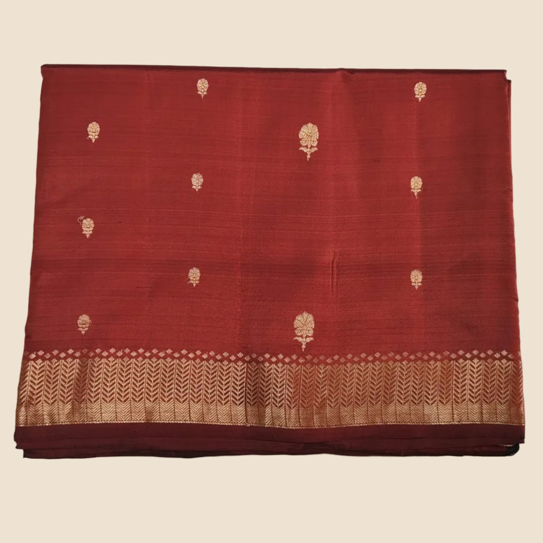 Red fabric with gold tree patterns on a white background