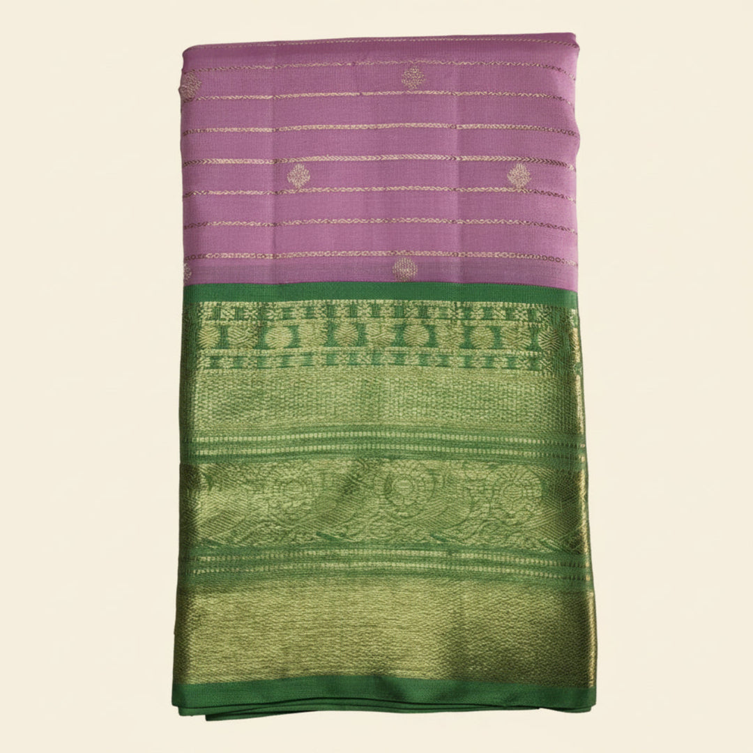 Purple and green fabric with intricate patterns on a white background