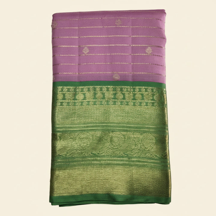 Purple and green fabric with intricate patterns on a white background