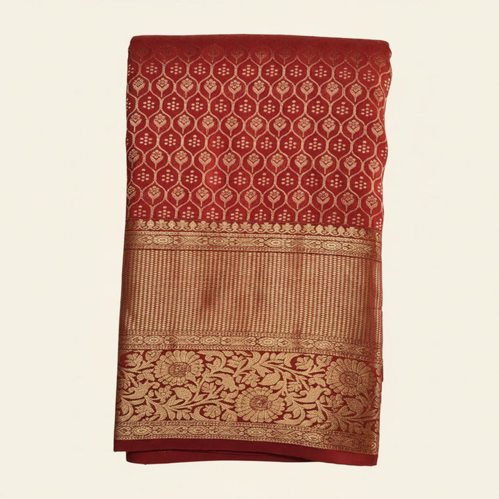 Red and gold patterned fabric on a white background