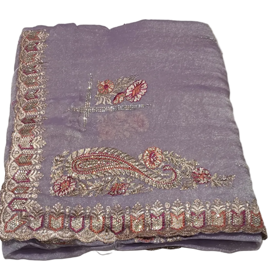Lavender fabric with intricate gold and pink embroidery on a white floor.