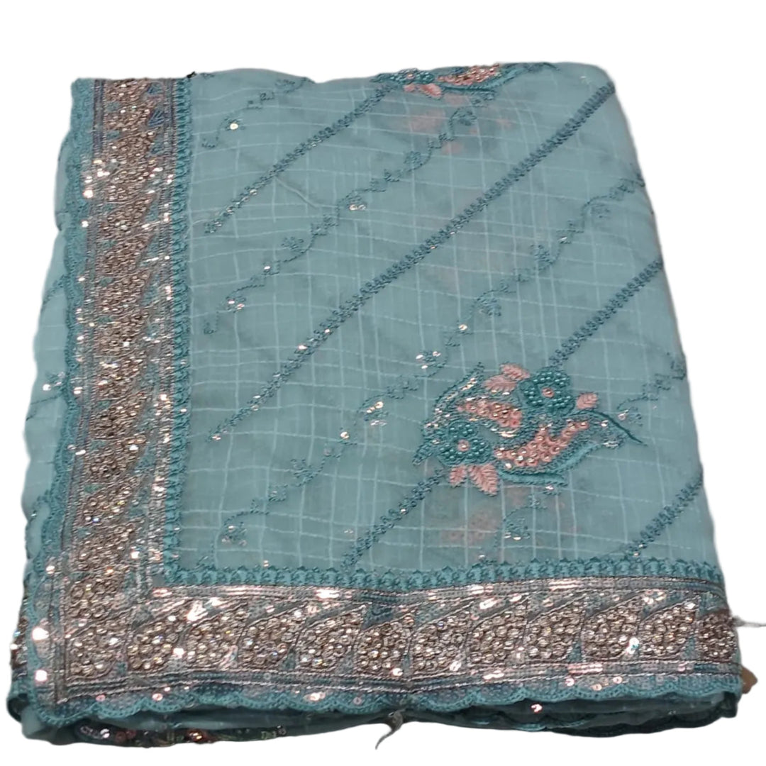 Light blue fabric with intricate silver and gold embroidery