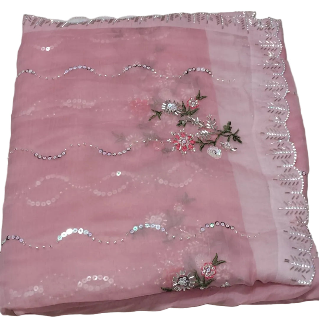 Pink fabric with floral embroidery and sequin border